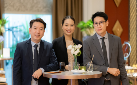 Three UCD alumni at an event.